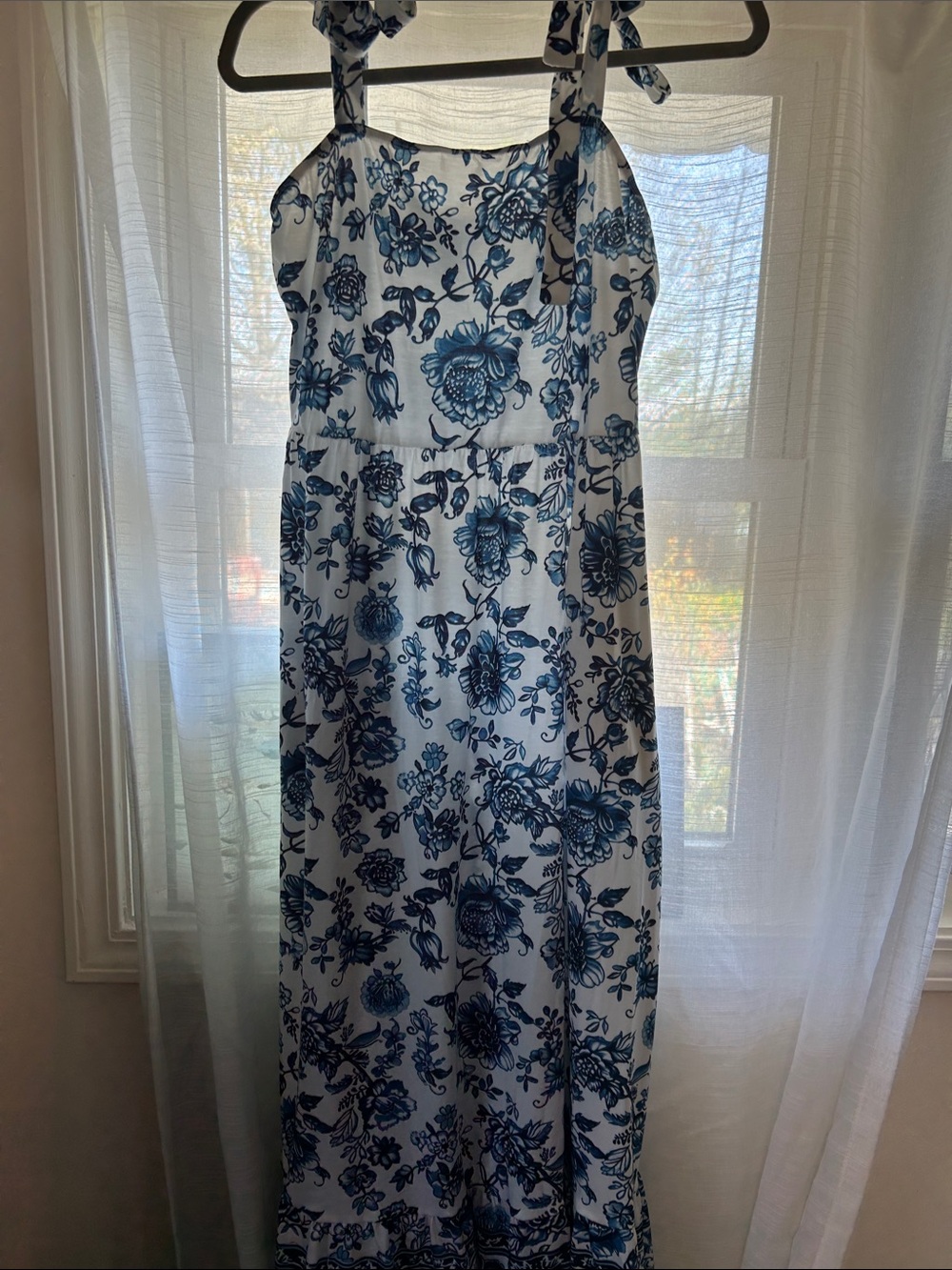 White Maxi Dress with Blue Floral Print and Tie Straps can be crisscrossed